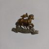 The Queen's Regiment Cap Badge available at Hein Ventures' Antique Shop