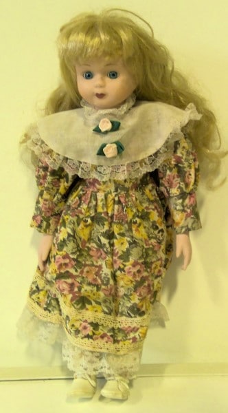 Porcelain Doll in Floral Dress for sale on Hein Ventures' online antique and collectibles store