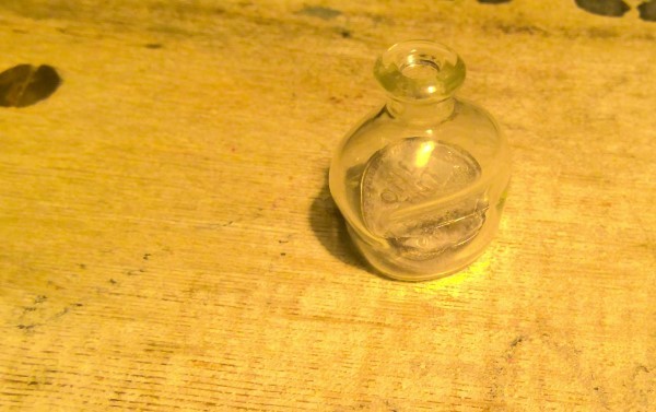 1945 U.S. Wheat Cent in a handblown bottle for sale