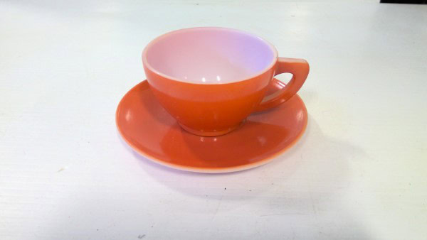 Mid Century Modern Dominion Glass Orange Tea Cup and Saucer. for sale