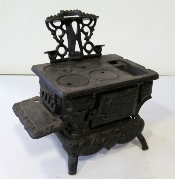 Antique Cast Iron Crescent Toy Stove. for sale